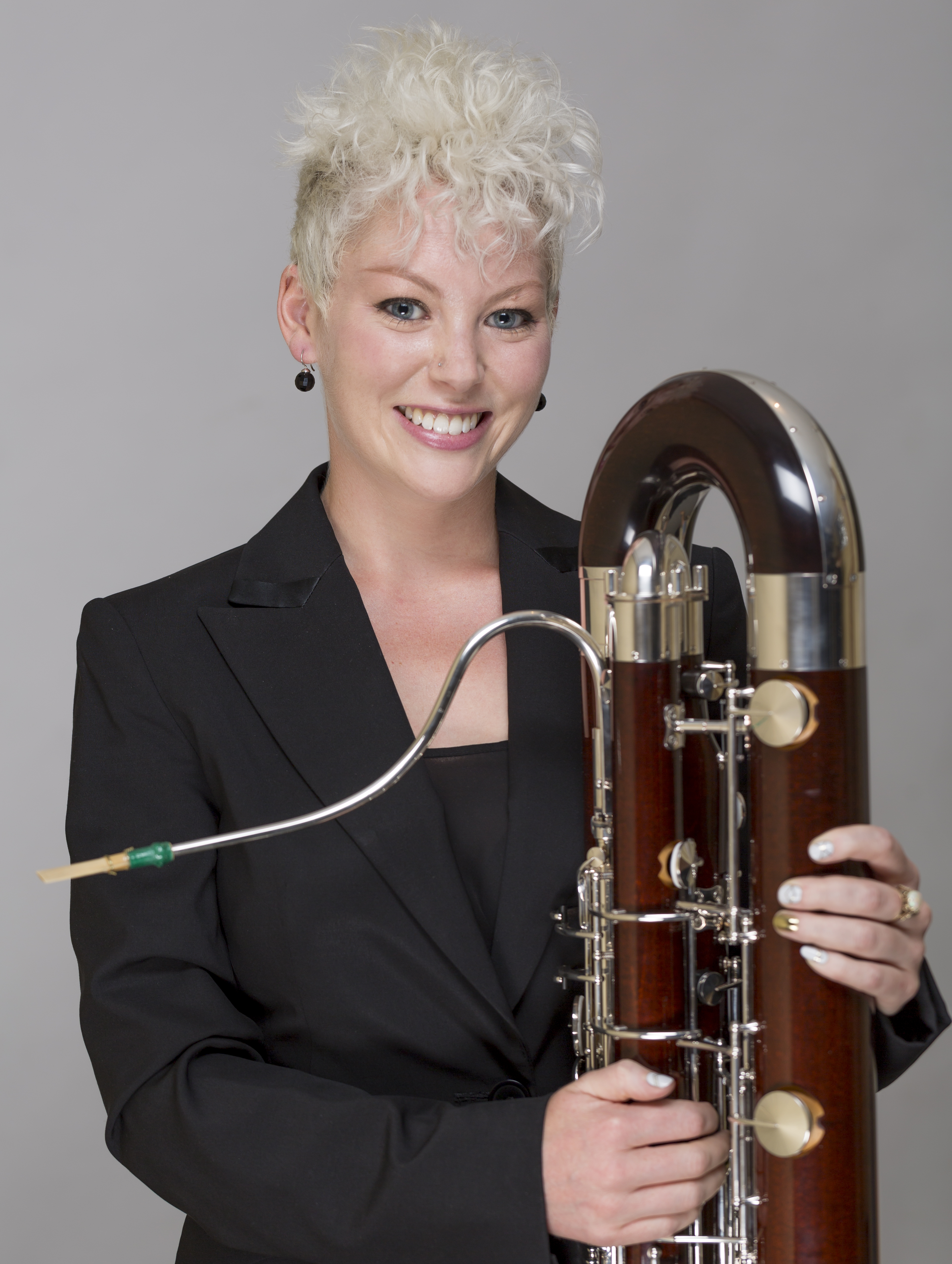 Chloe Turner holding a contrabassoon