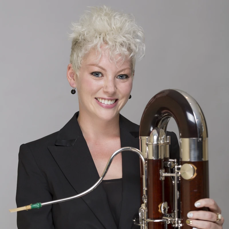 Chloe Turner holding a contrabassoon