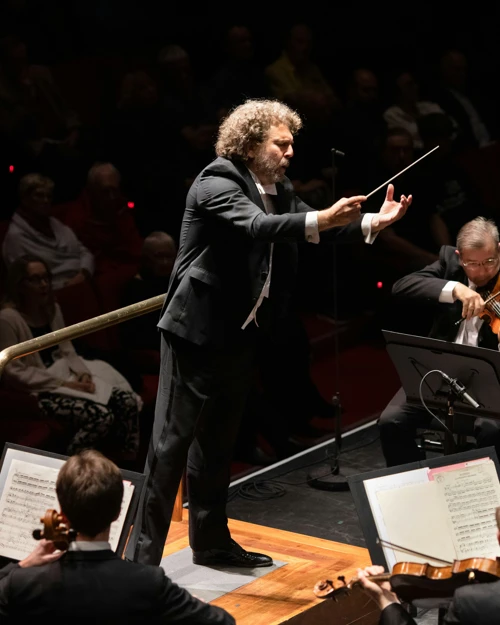 Give It a Go Asher Fisch is in motion conducting WASO