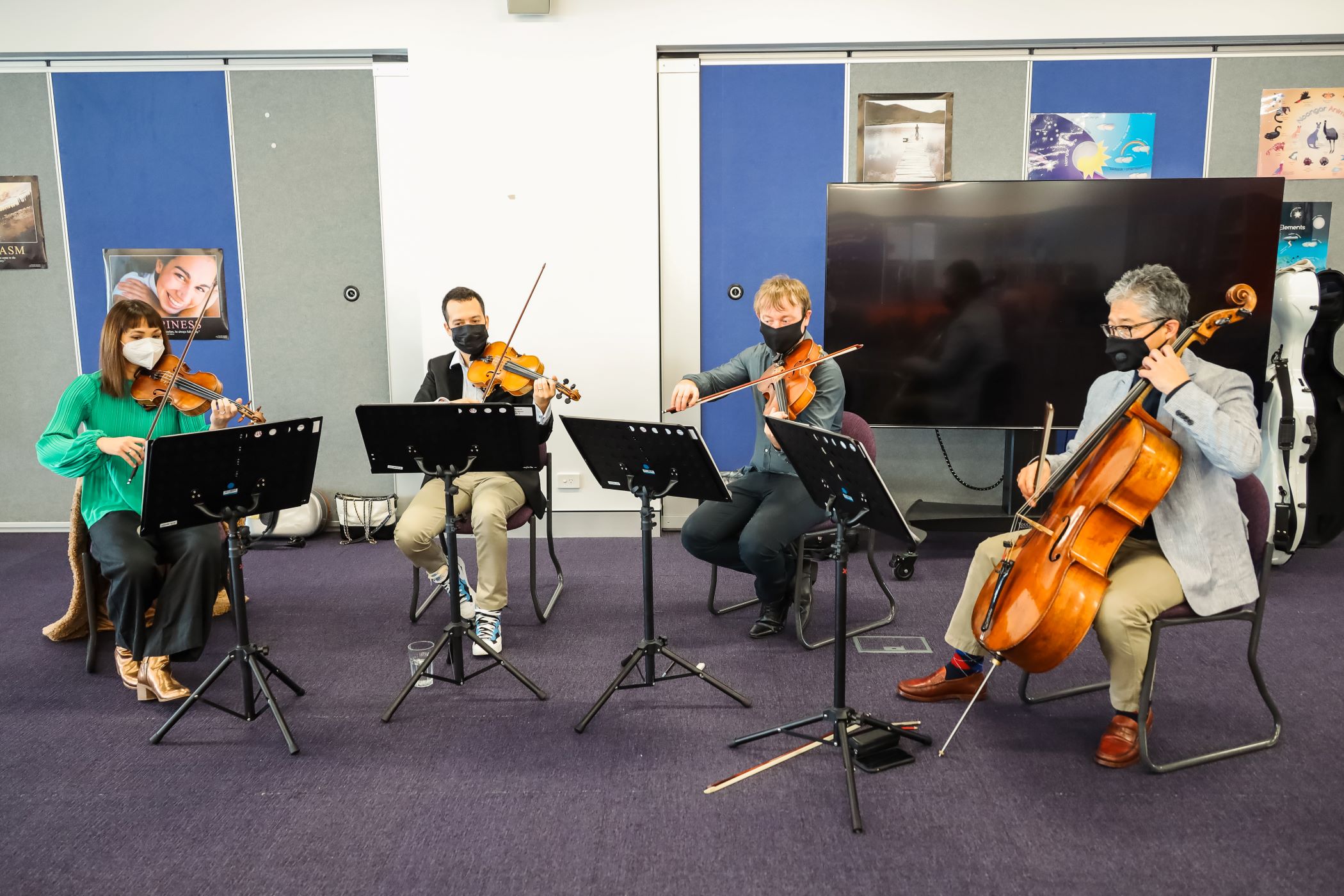 A WASO string quartet performs in a school classroom.