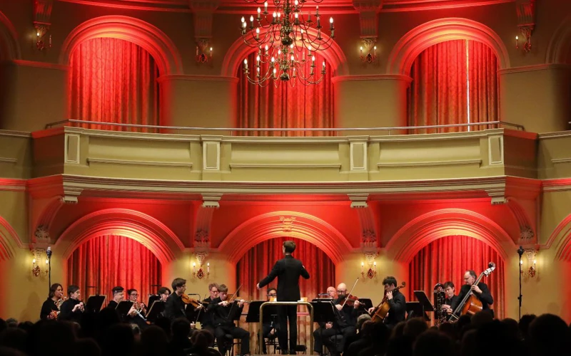 Government House Ballroom WASO chamber ensemble performing on stage at Government House Ballroom, beneath a decorative chandelier.