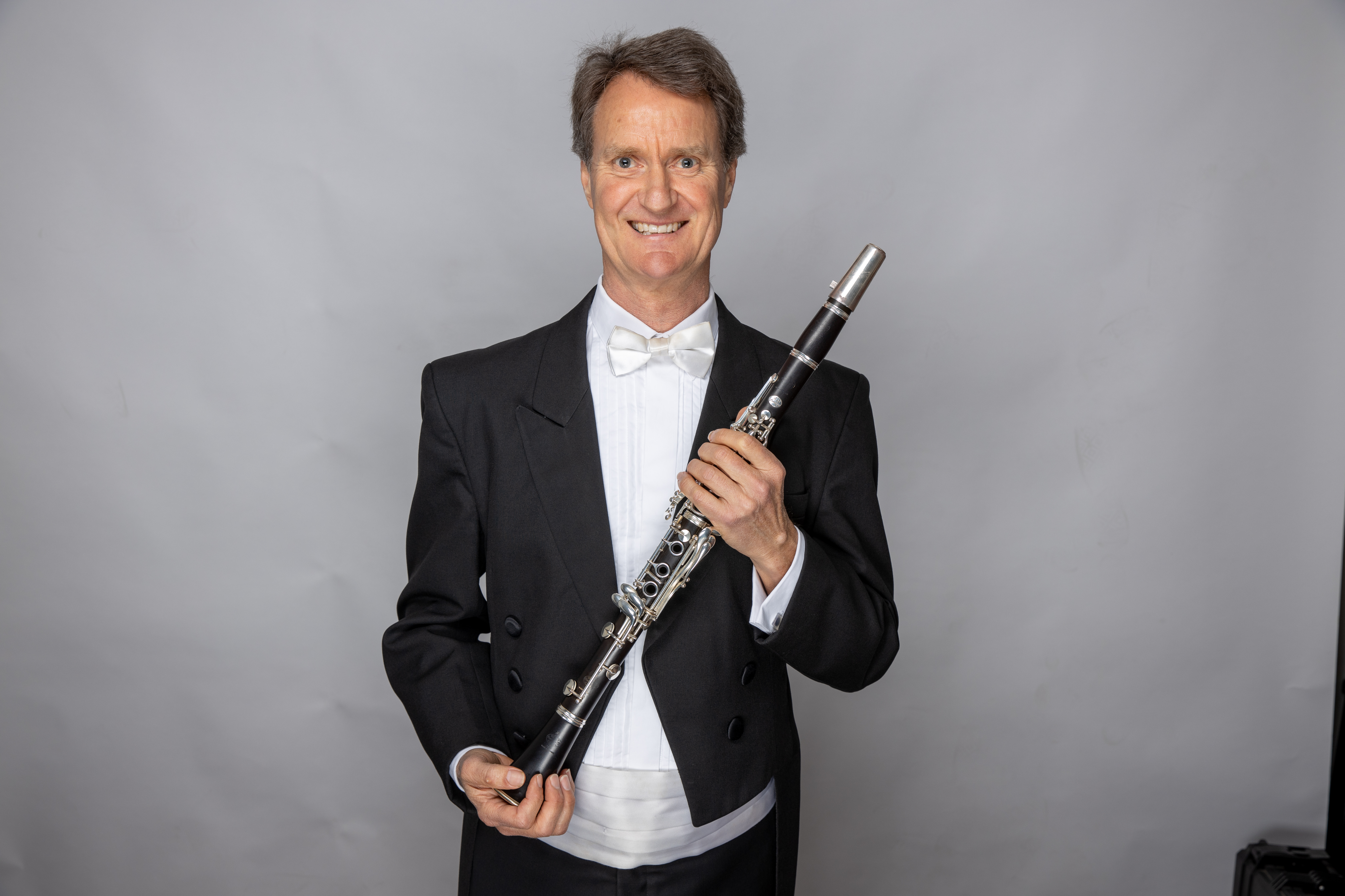 Allan Meyer holding a clarinet
