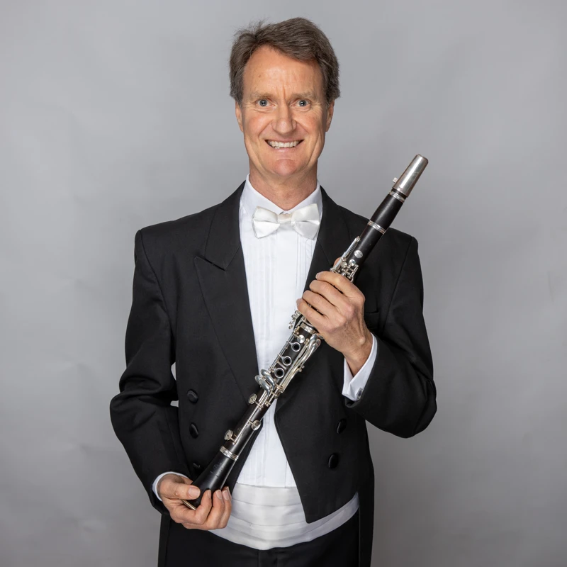 Allan Meyer holding a clarinet
