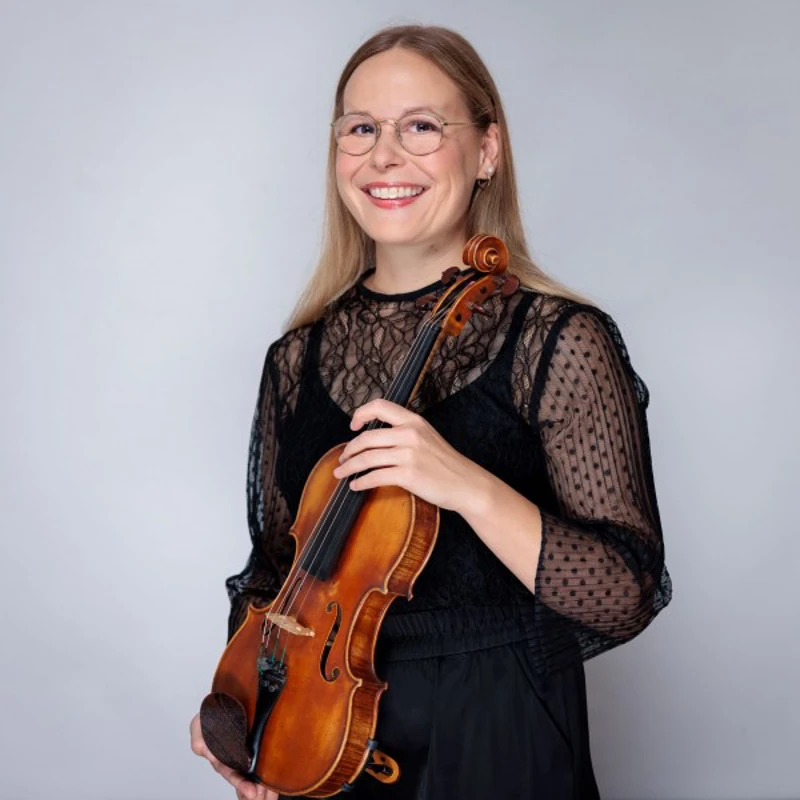 Emma Hunt holding a violin