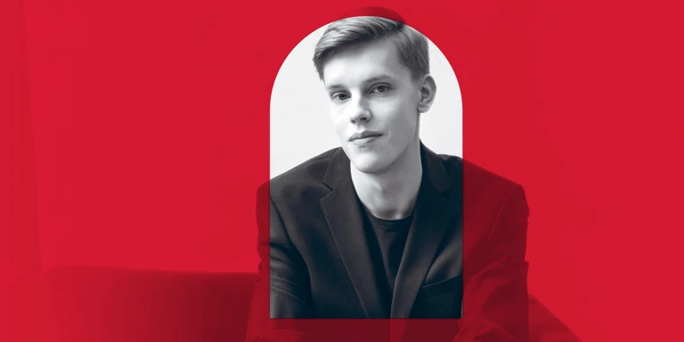 A promotional image of a conductor with a red overlay, red aligns with the branding for the 2026 MACA Symphonic Series