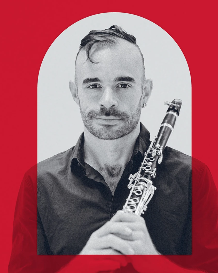 Promotional image of a musician holding a clarinet with a red overlay to align with the branding colour for the MACA Symphonic Series