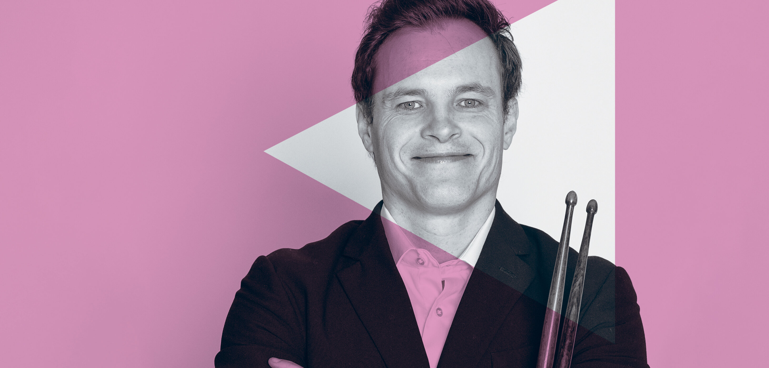 Promotional image of a musician holding his drum sticks, with a pink overlay to align with the Special Events Series branding