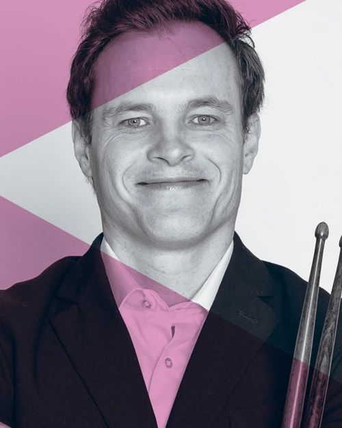 Special Events Promotional image of a musician holding his drum sticks, with a pink overlay to align with the Special Events Series branding
