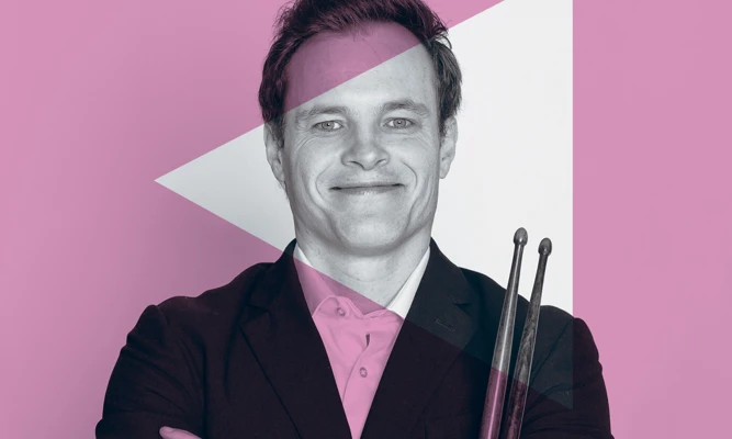 Promotional image of a musician holding his drum sticks, with a pink overlay to align with the Special Events Series branding