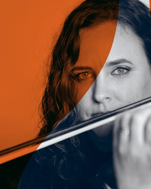Explore Series Promotional image of a musician playing her violin, with an orange overlay to align with the Chamber Series branding