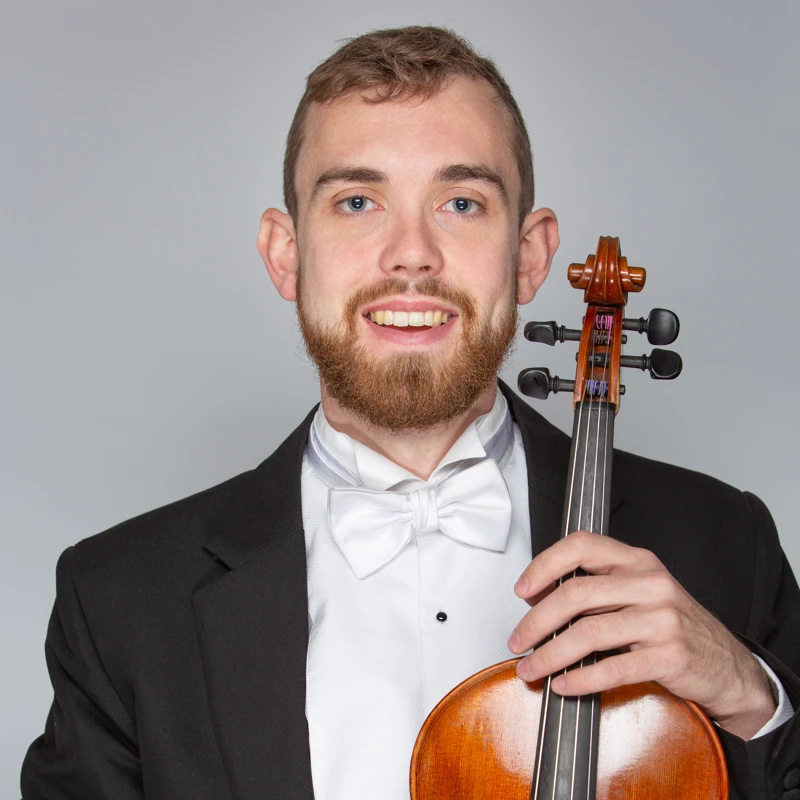 Elliot O'Brien holding a viola