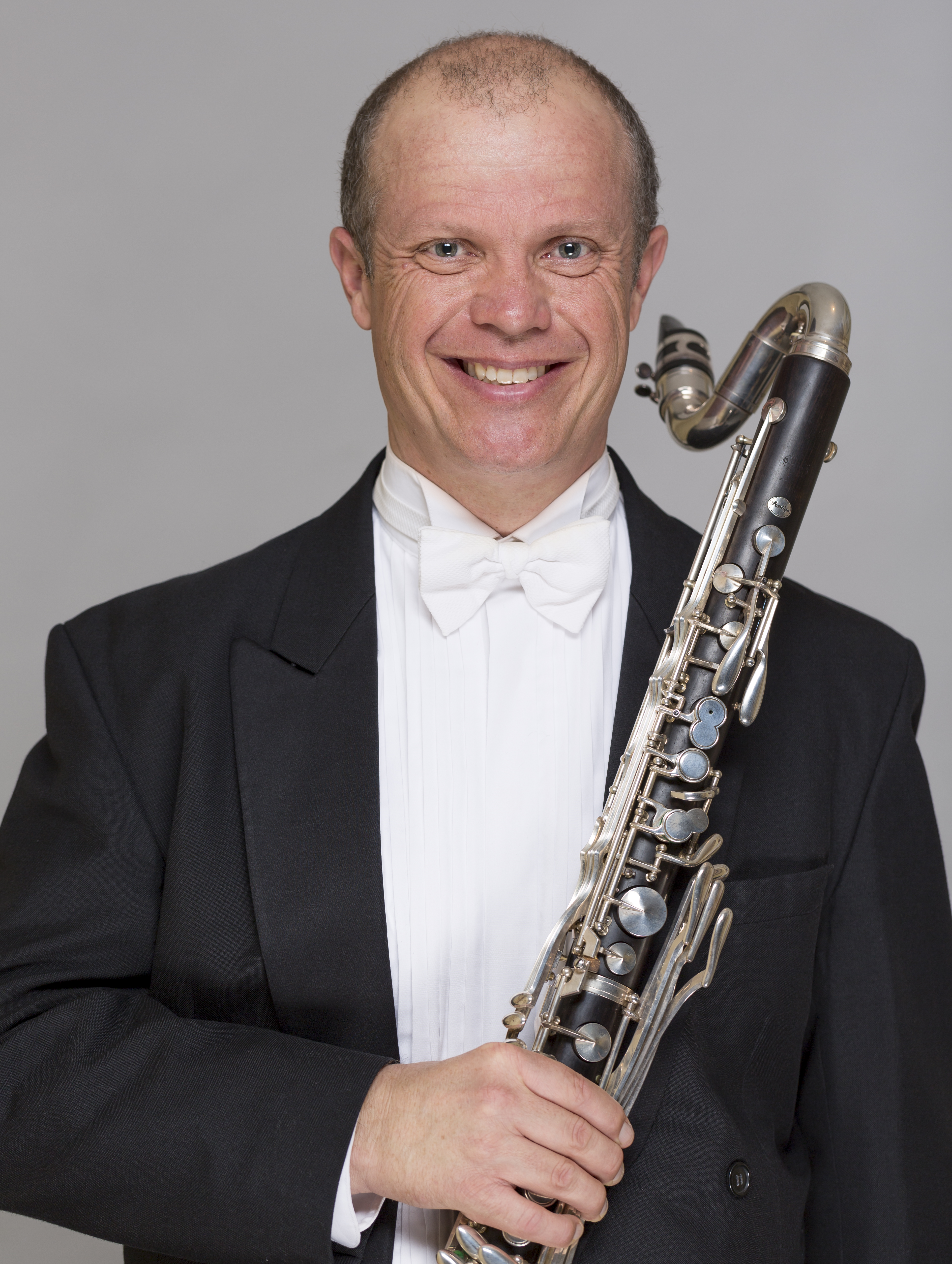 Alex Millier holding a bass clarinet