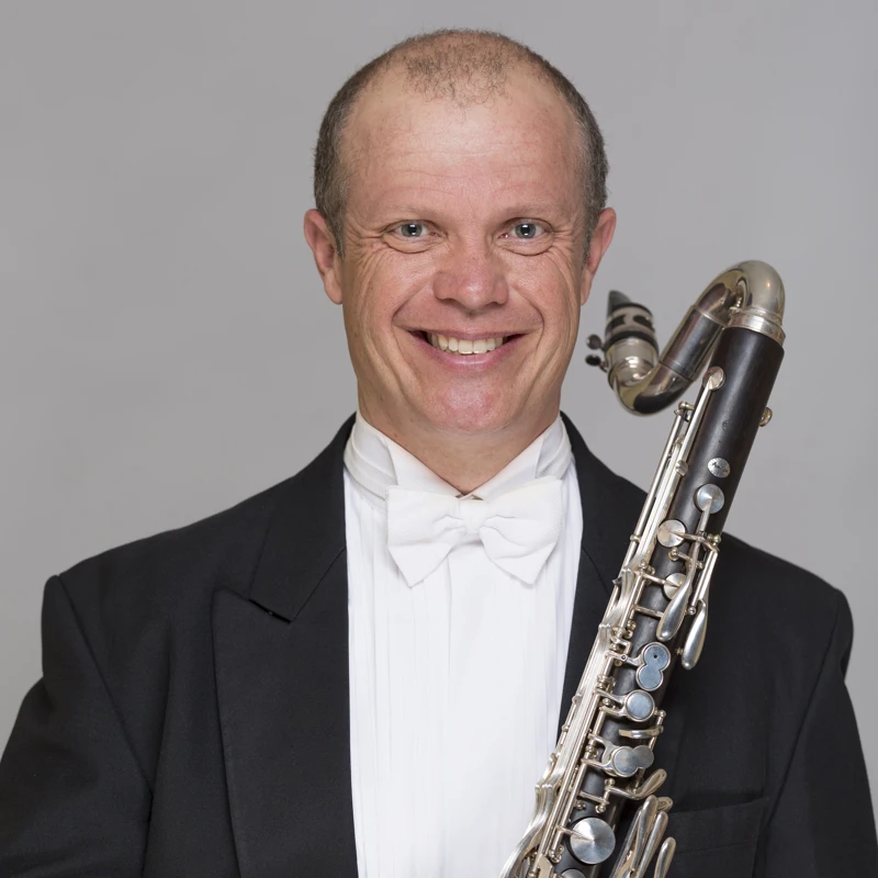 Alex Millier holding a bass clarinet
