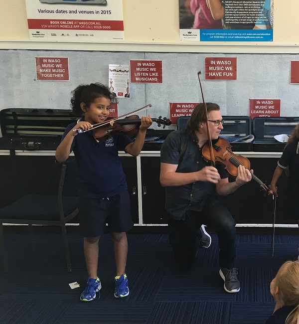 Medina Primary School violin student and Crescendo teaching artist.