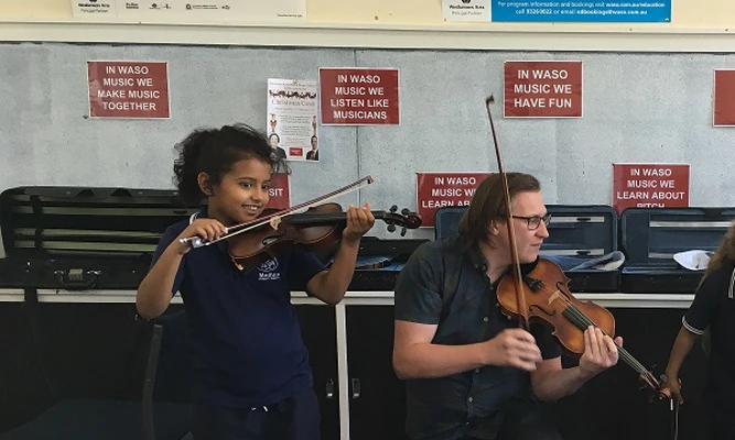 Medina Primary School violin student and Crescendo teaching artist.