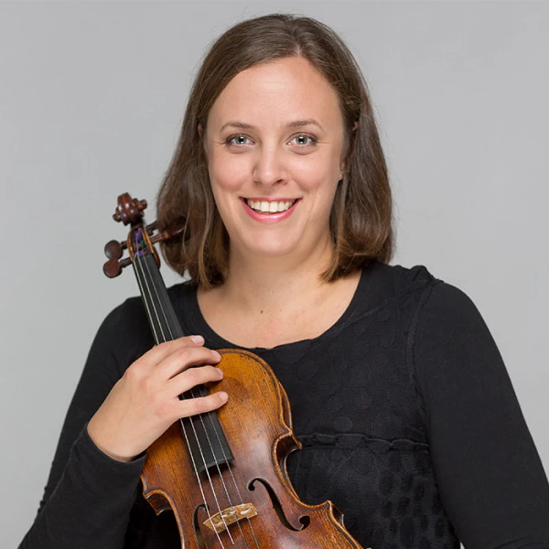 Rebecca Glorie holding her Violin