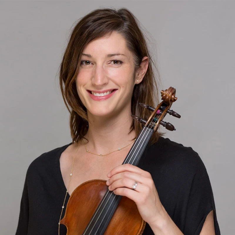 Stephanie Dean holding a violin