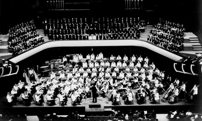 Black and white wide shot of WASO performing on stage for the opening of Perth Concert Hall in 1975.