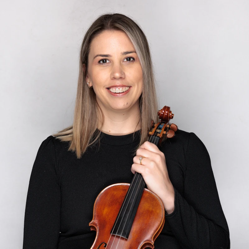 Andrea Mendham holding a violin