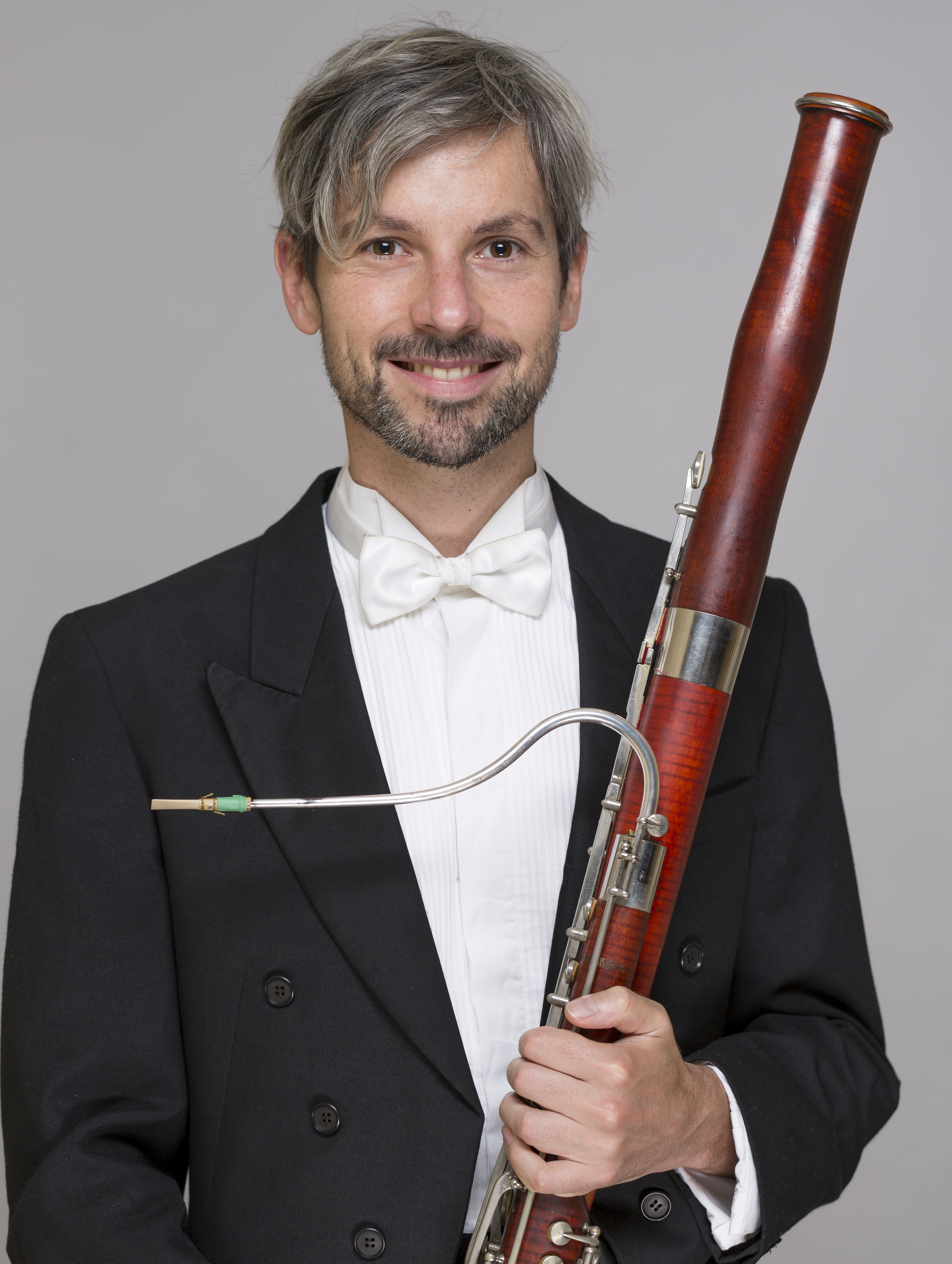 Adam Mikulicz holding a bassoon