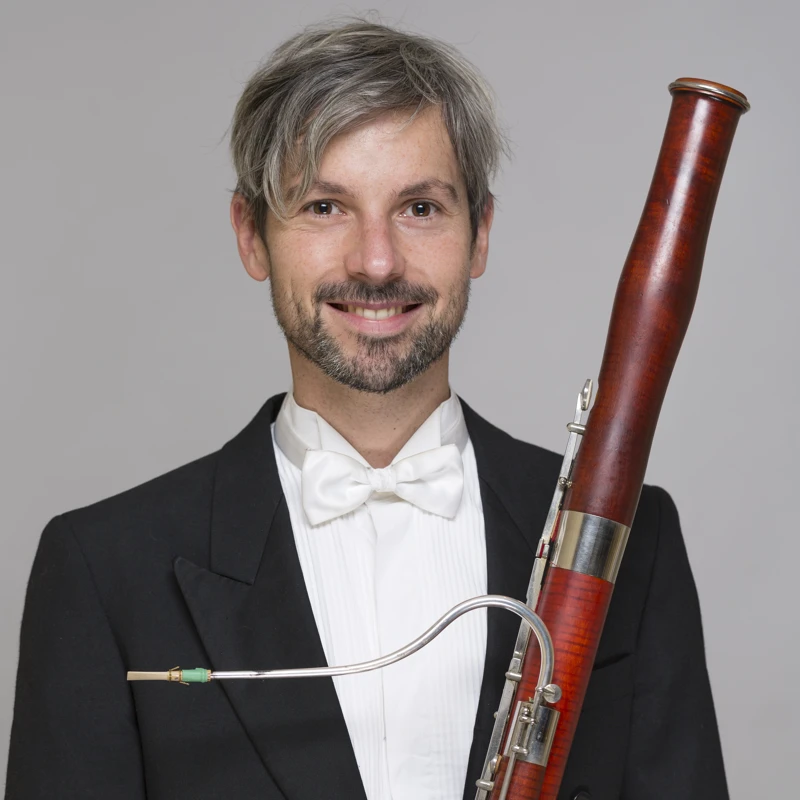Adam Mikulicz holding a bassoon