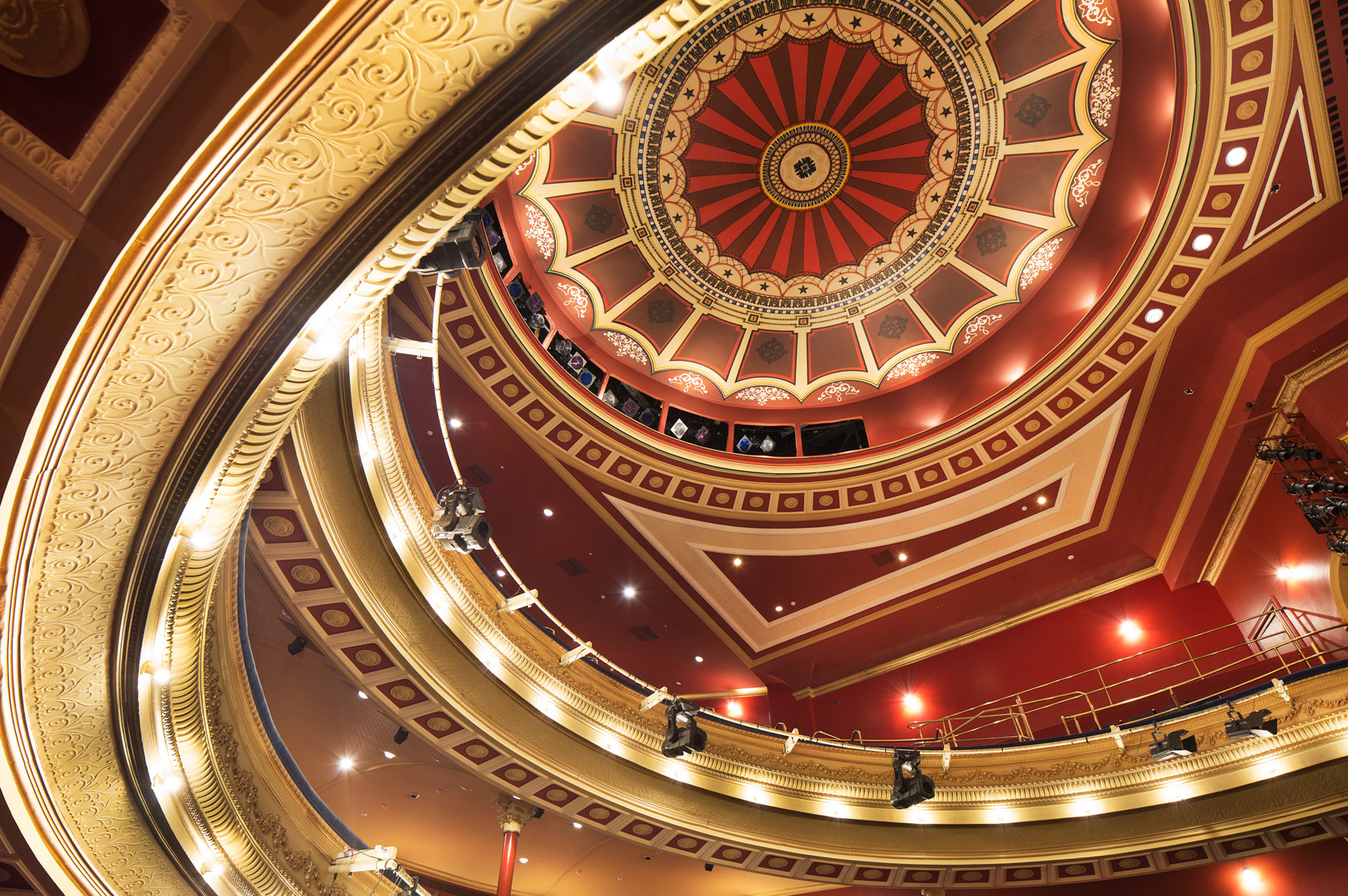 His Majesty's Theatre's ornate red and gold dome ceiling.