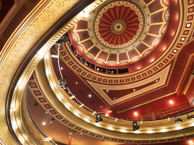 His Majesty's Theatre's ornate red and gold dome ceiling.