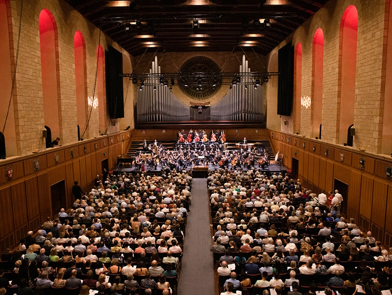 Browse Events WASO performing on stage to a full audience at Winthrop Hall.