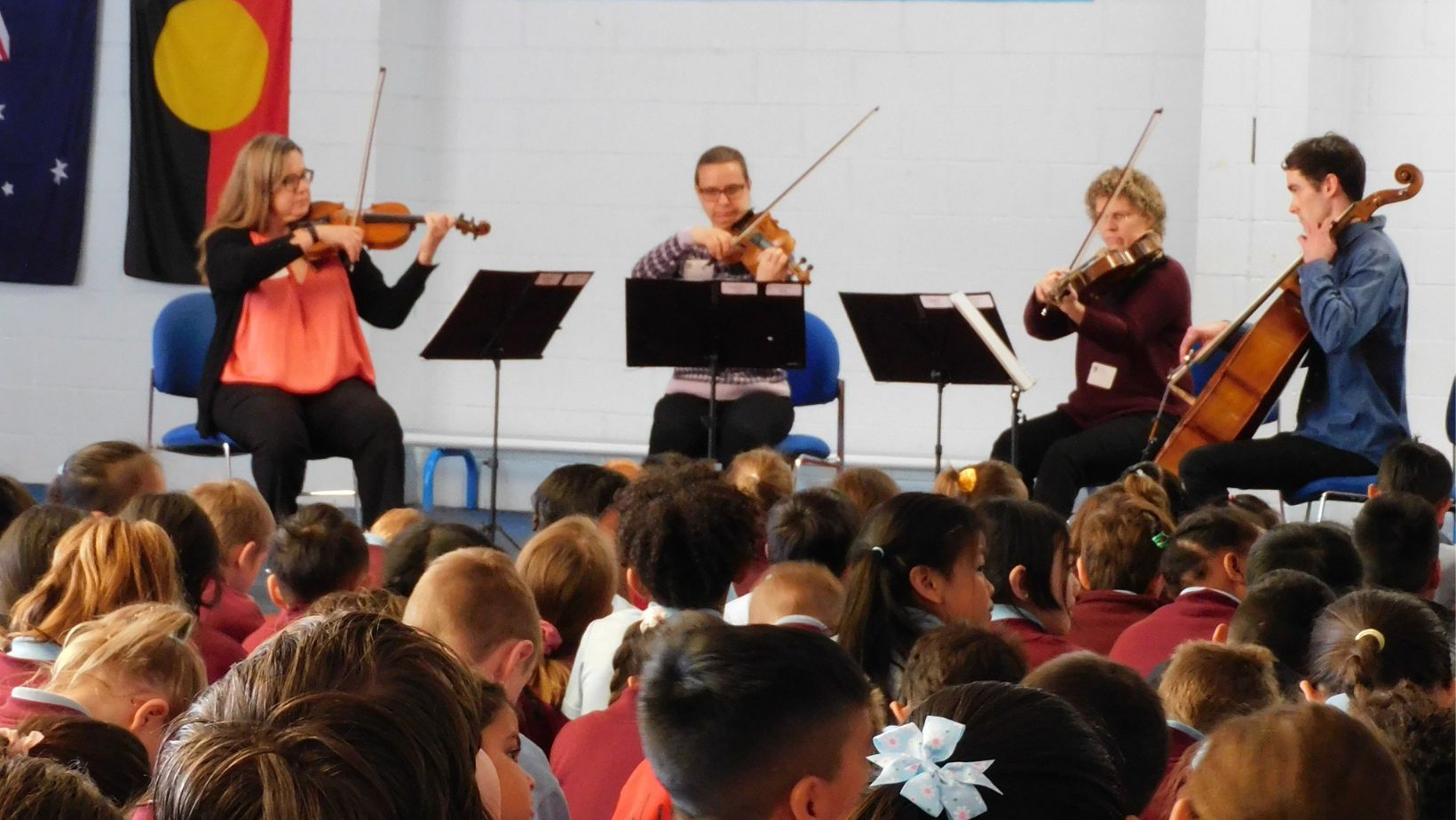 A WASO string quartet performs for a group of primary school students.